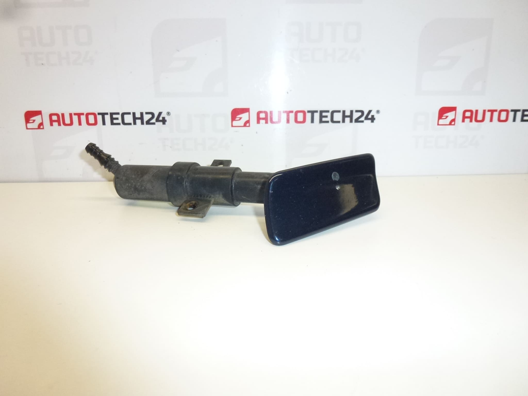 Spryskiwacz reflektora lewy Peugeot 406 0308011012 1852455016 6438E9